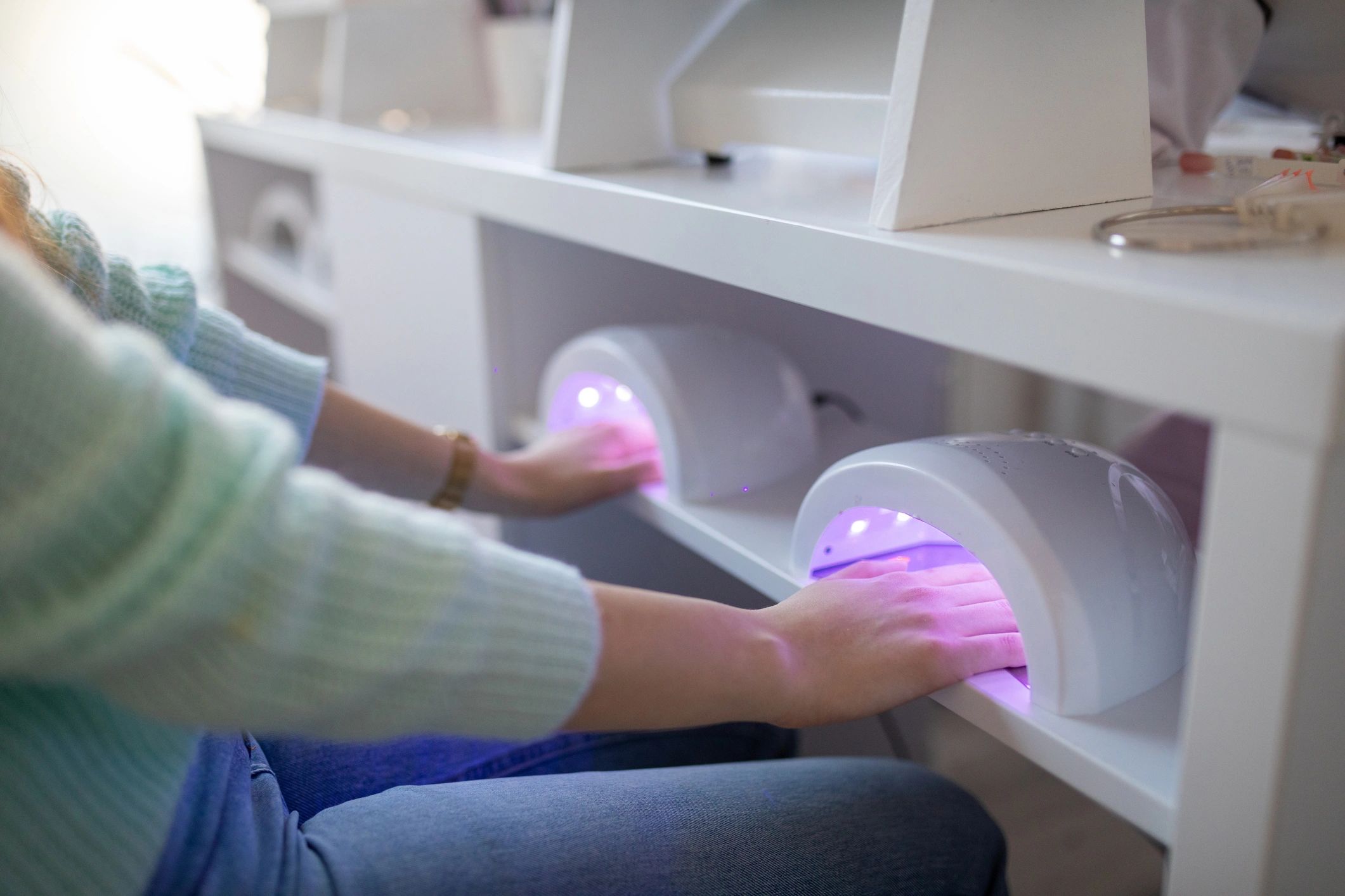 Nail salon UV lamp manicure