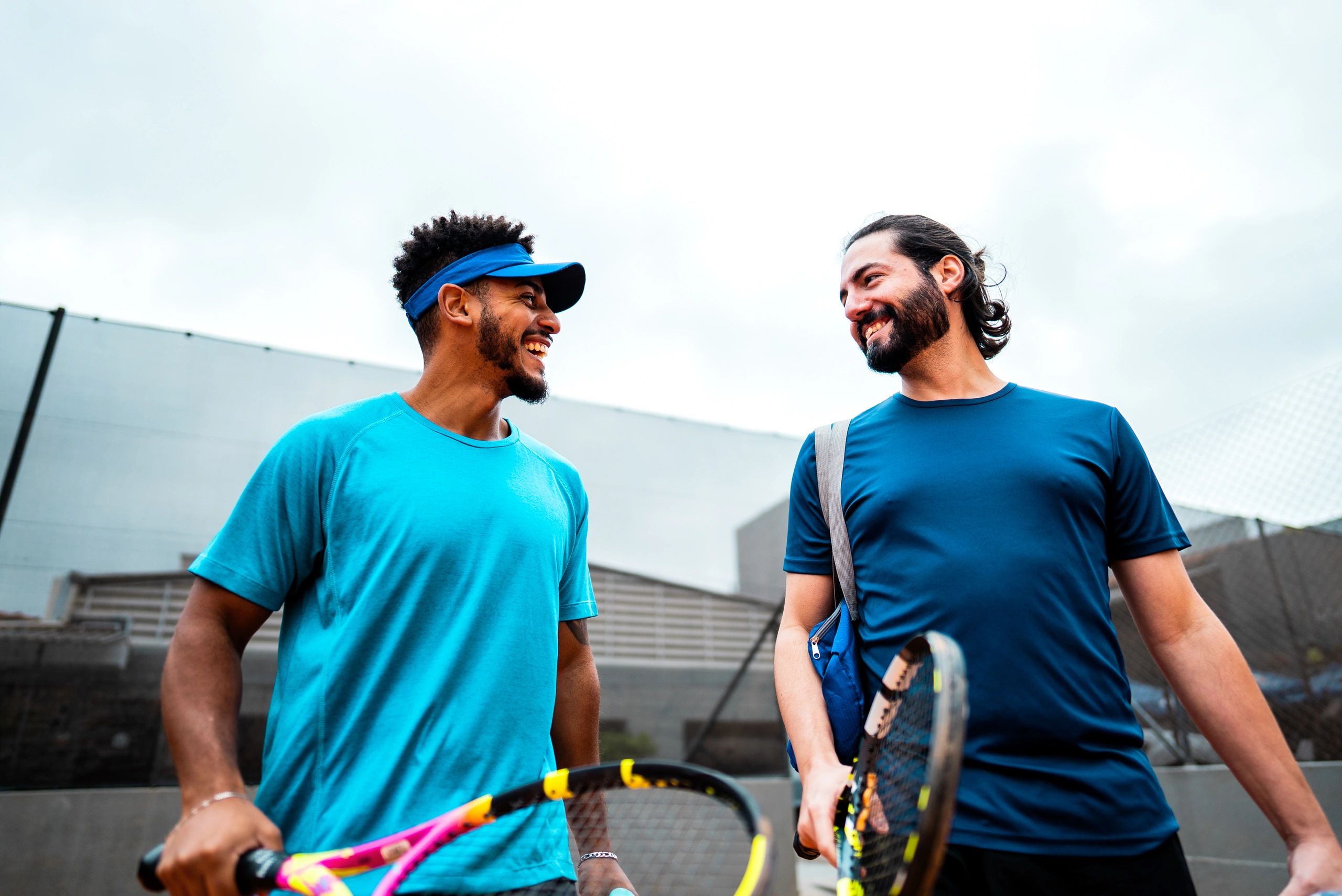 Tennis players walking and chatting