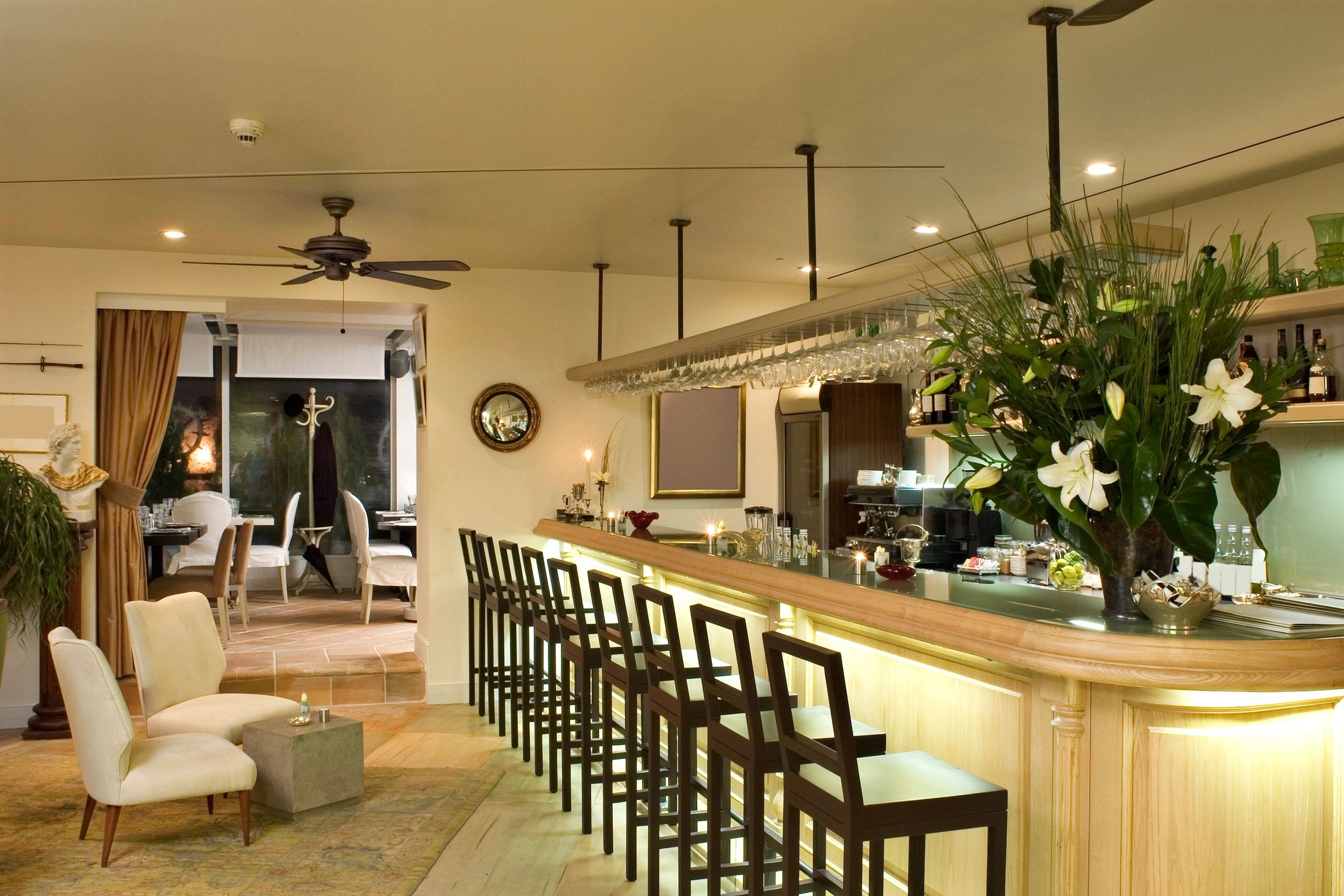 Chic cocktail bar interior with high-top seating
